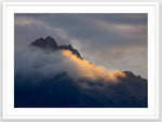 Walter Peak sunbeam is Queenstown's Walter Peak that can be seen from all over Queenstown. Cloudy sunset on Mountain top Lake Wakatipu, New Zealand. A1 size