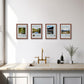 Four framed Great Walks posters on a white wall above a kitchen sink. The prints show wild national parks landscapes.