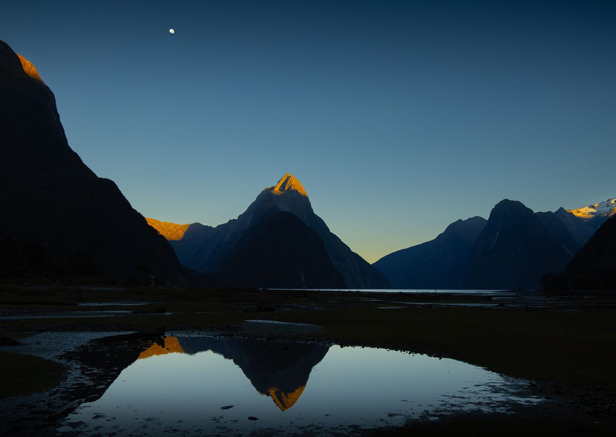Mitre Peak New Zealand
Framed wall art 'Mitre te atakura' Mitre Peak dressed in her red tips of dawn, te ata kura, on a rare and beautifully clear, still, morning. Milford Sound New Zealand. 