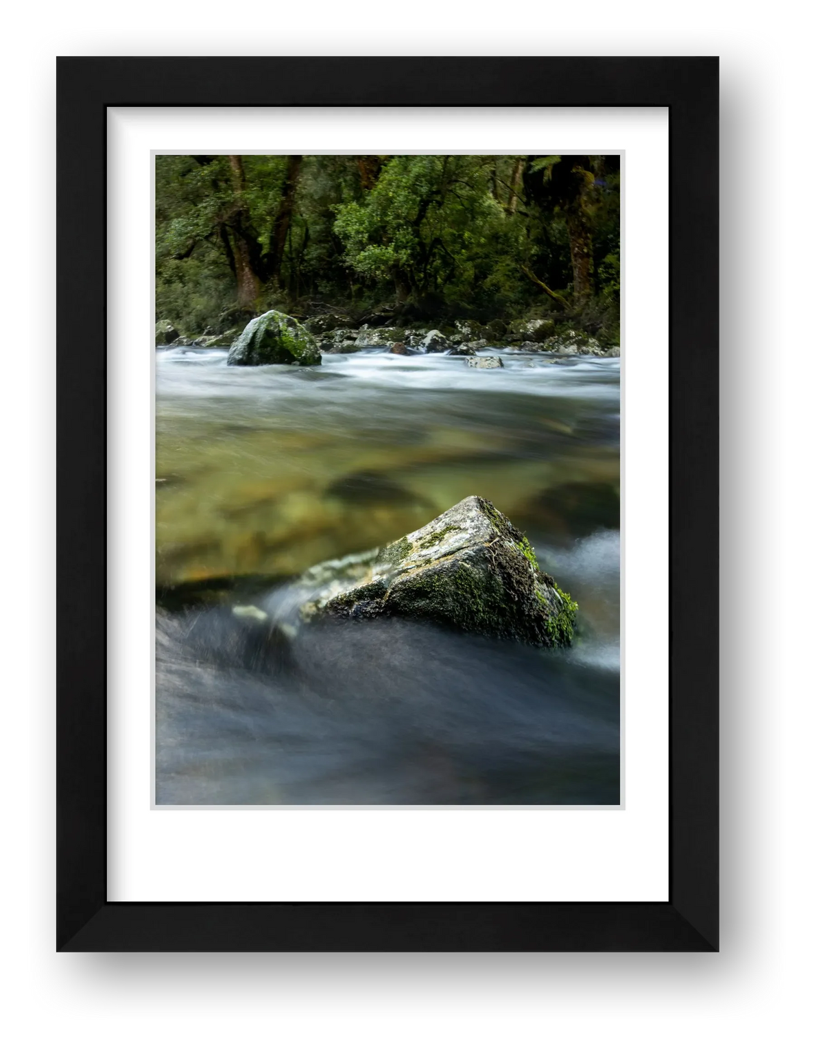 Milford Track, river rocks in the clear wilderness waters of a moody Clinton River, Fiordland, New Zealand.
Feel the wild, otherworld beauty of Fiordland, everyday at your place. 

