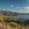Sweeping sunset views of Queenstown's Remarkables mountain range in late spring, overlooking Lake Wakatipu, New Zealand